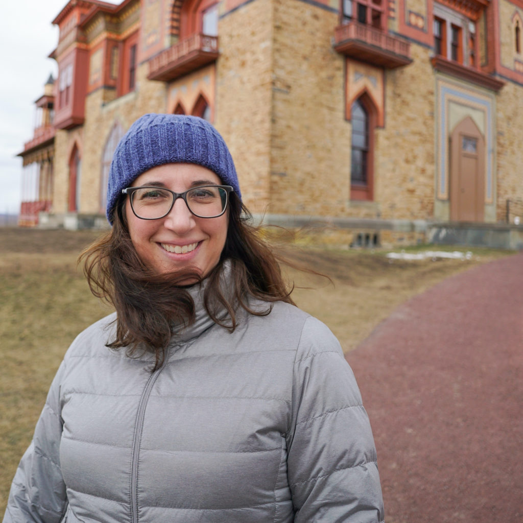 Author profile photo in front of Olana State Historic Site in Hudson, NY.